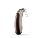 A Basic Hearing Aid Device Designed For Essential Hearing Needs Placed On A Soft Surface